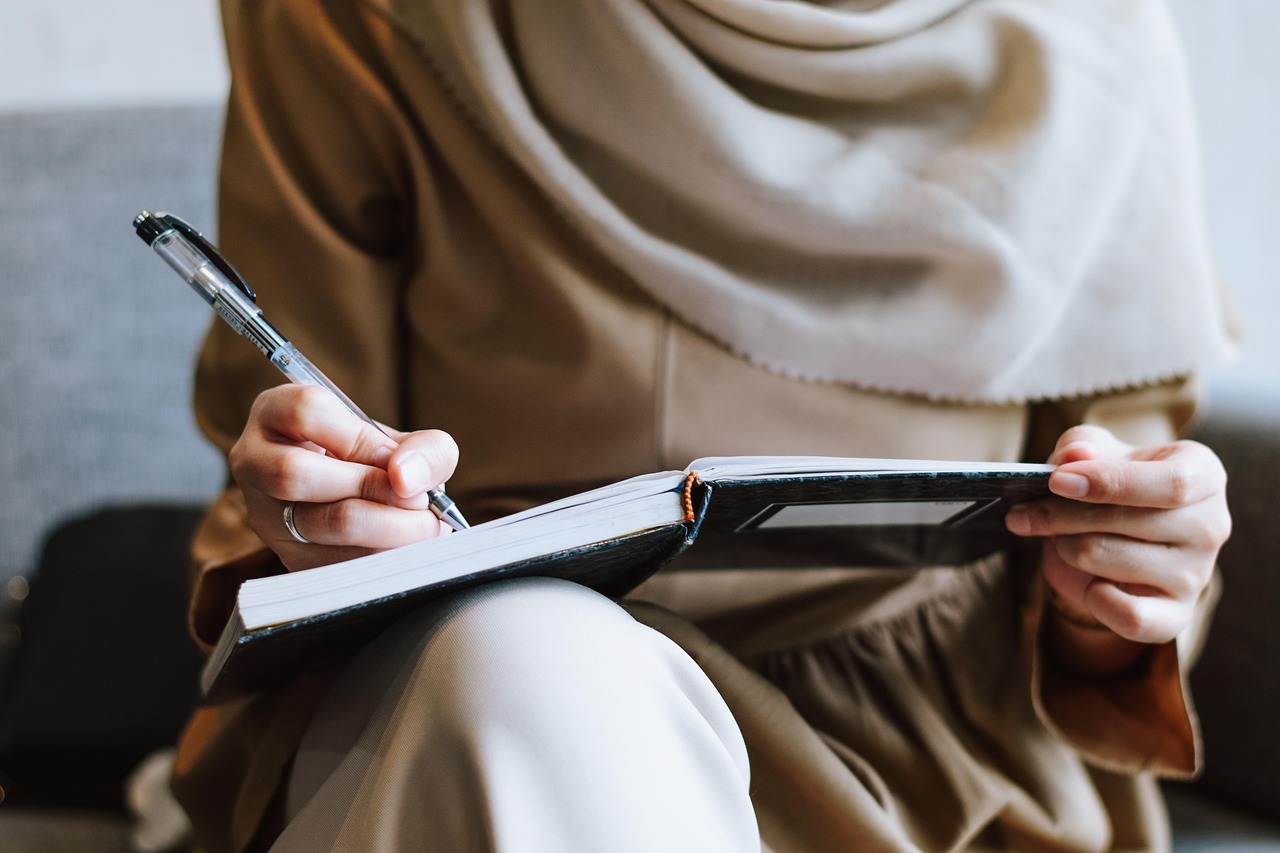 Muslim, woman, writing — The Five Best Work From Home Businesses to Start on a Shoestring